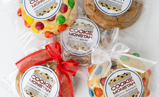 Packaged cookies with 'Cookie Monstah' labels on a white background